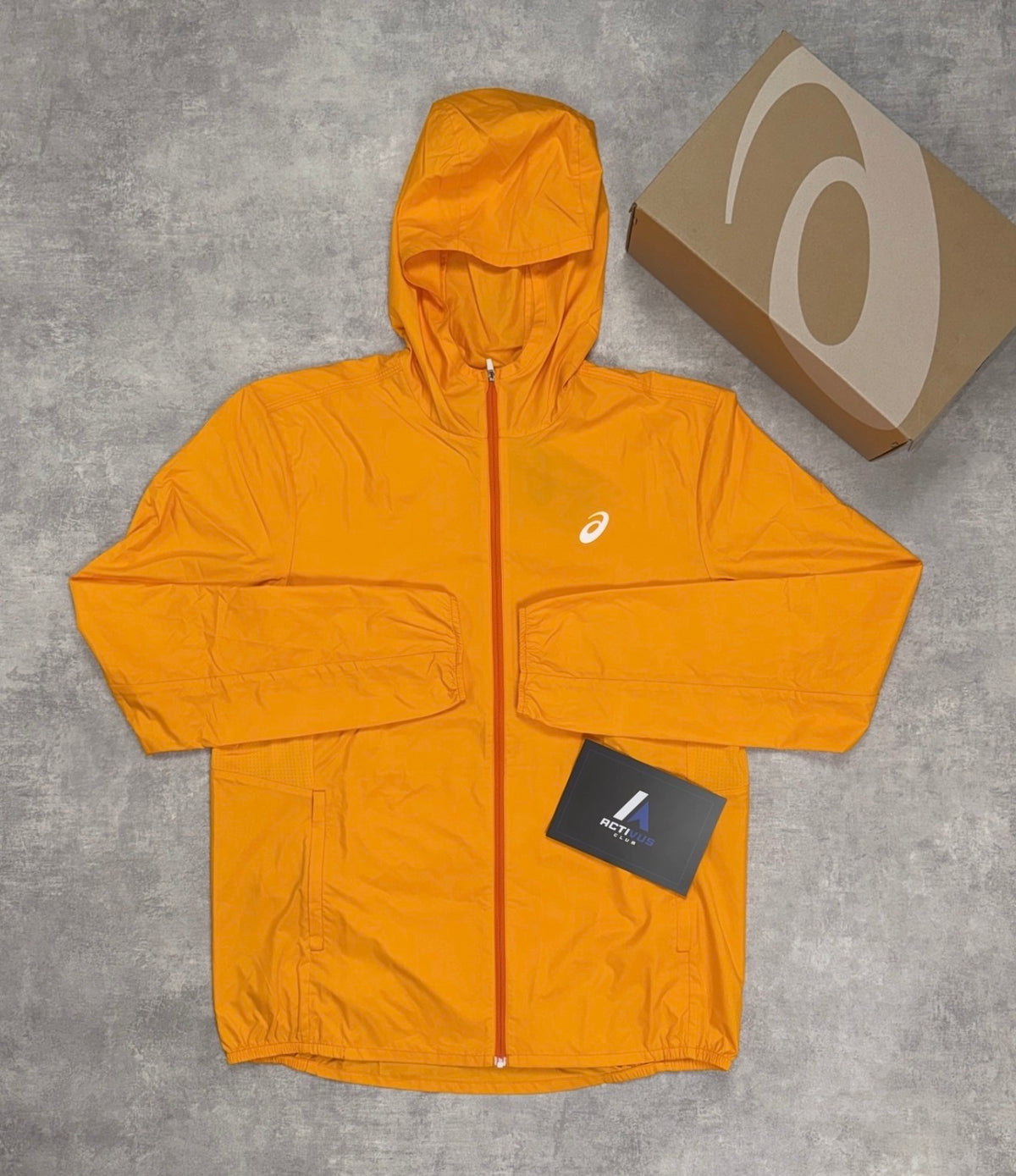 ASICS CORE JACKET (YAMABUKI ORANGE)